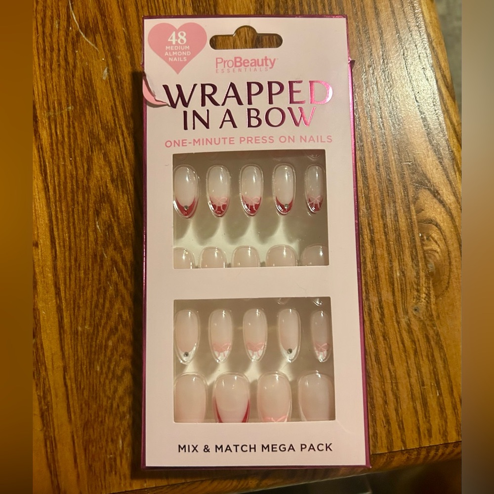 Victoria's Secret Press-On Nails in Soft Pink with Red Bow Tips